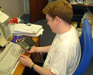 Palm Vx with Palm Reader being used by member of staff